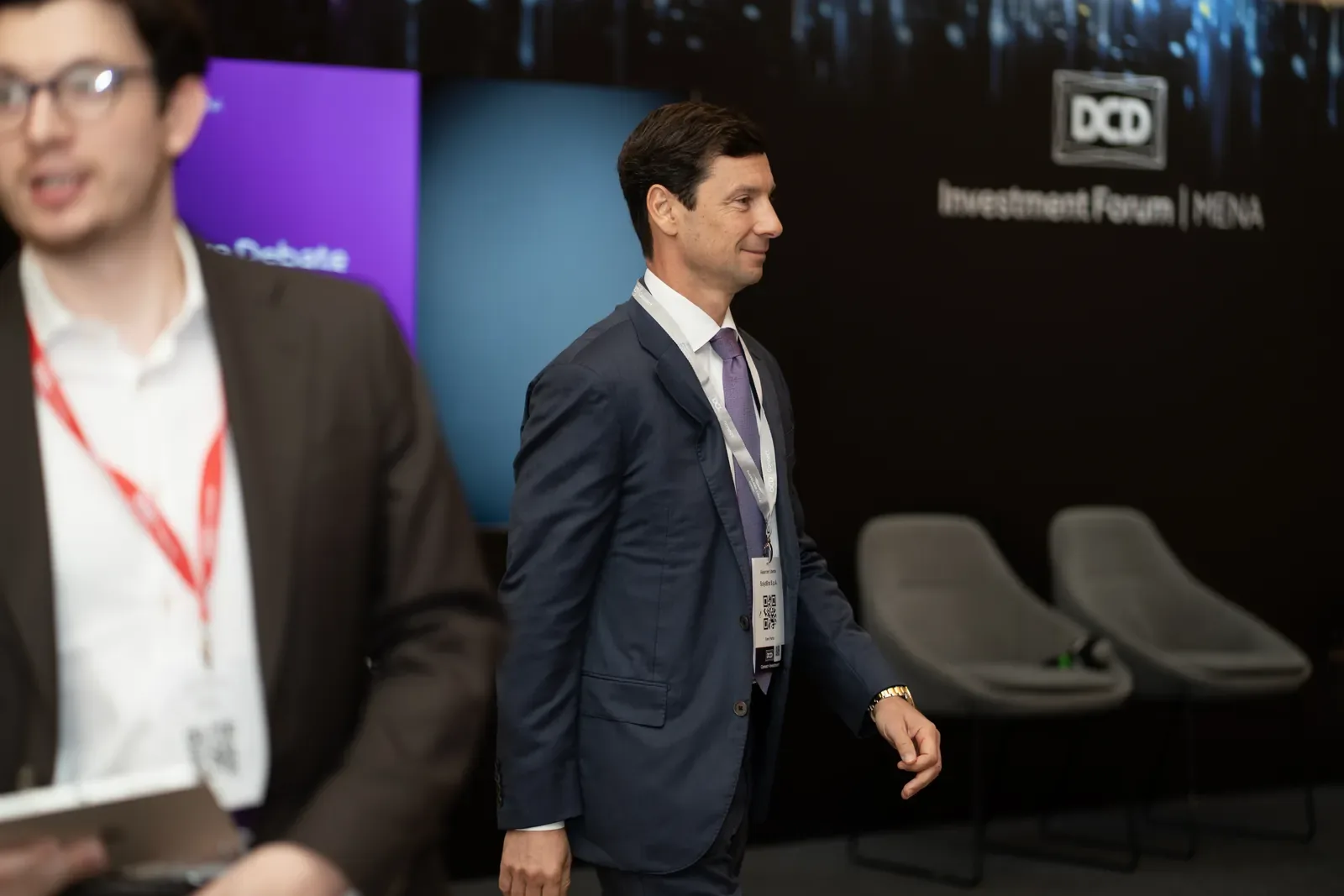 Speakers at an investment forum, conference photography by Pixer